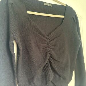 Pretty Garden black sweater with scrunched seams around bust. Size M.